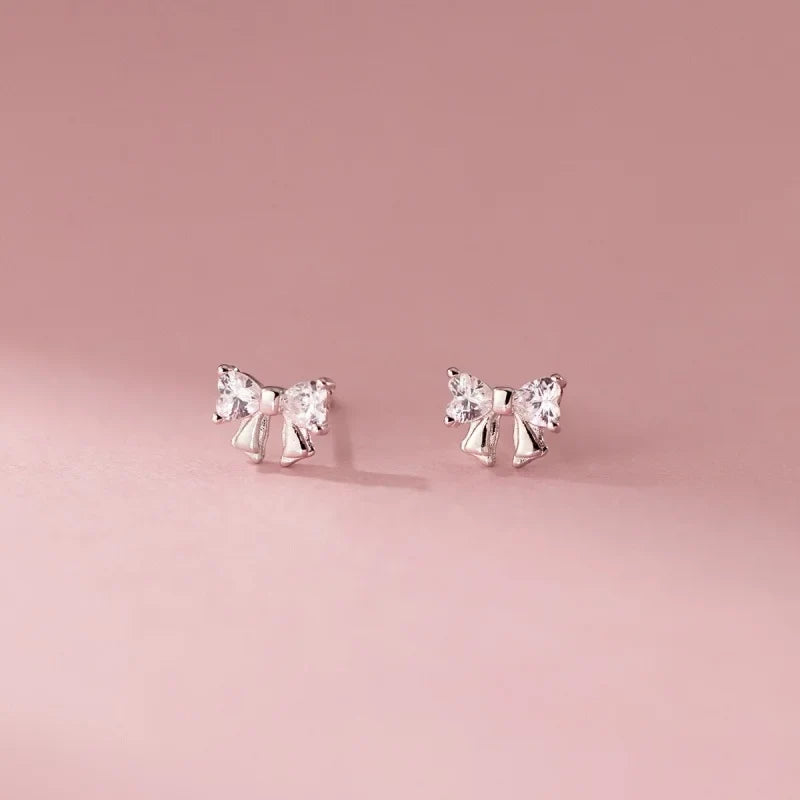 Aretes Moño con Zirconias Blancas o Rosas