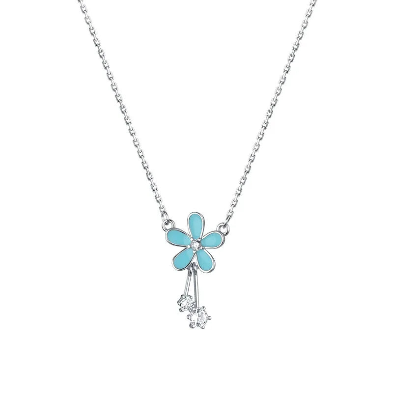 Aretes Flor Esmaltada Azul con Zirconias