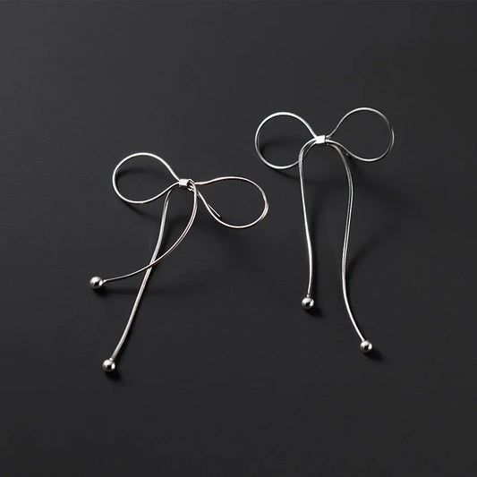 Aretes Moño con Flecos