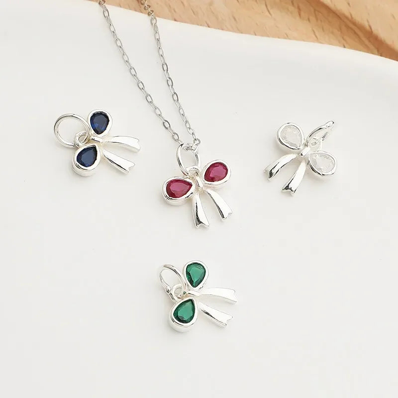 Dije Moño con Zirconias de Color