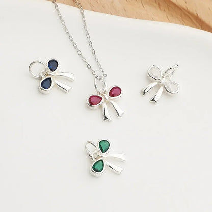 Dije Moño con Zirconias de Color