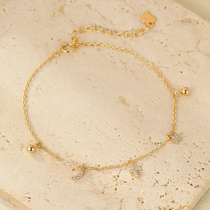 Pulsera Estrella, Luna y Cruz con Zirconias