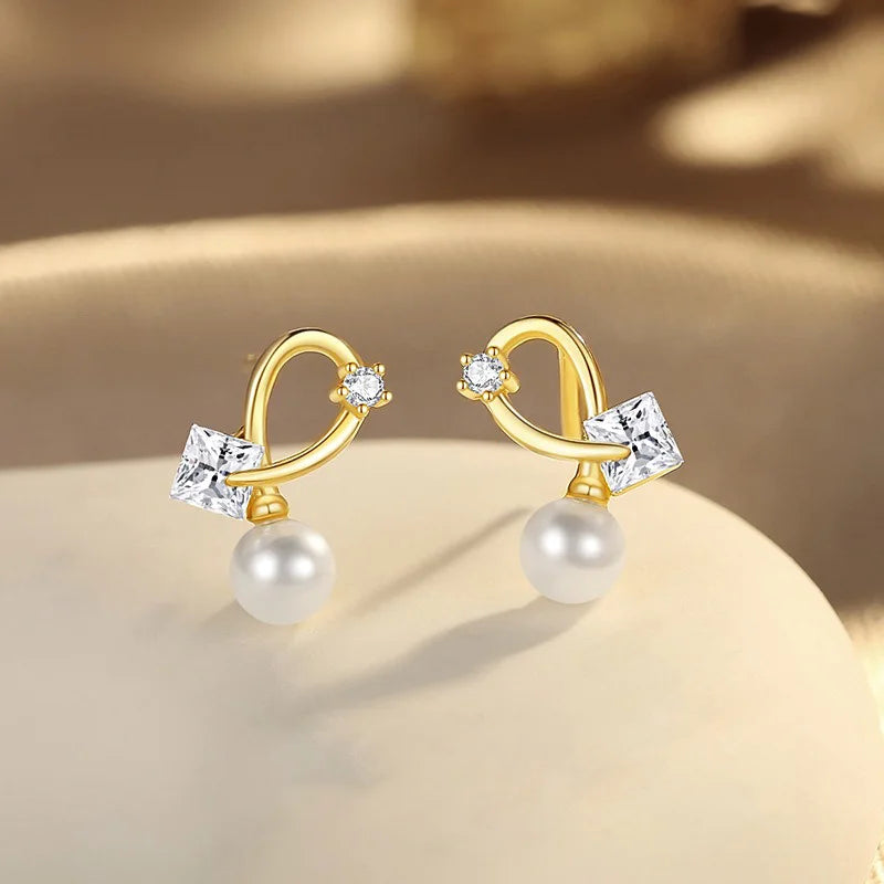Aretes Cruz con Perla y Zirconia Cuadrada