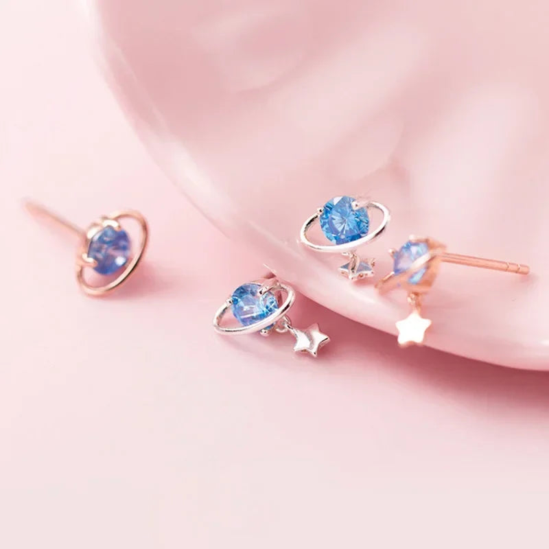 Aretes Planeta y Estrella con Zirconia Negra