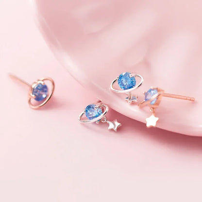 Aretes Planeta y Estrella con Zirconia Negra