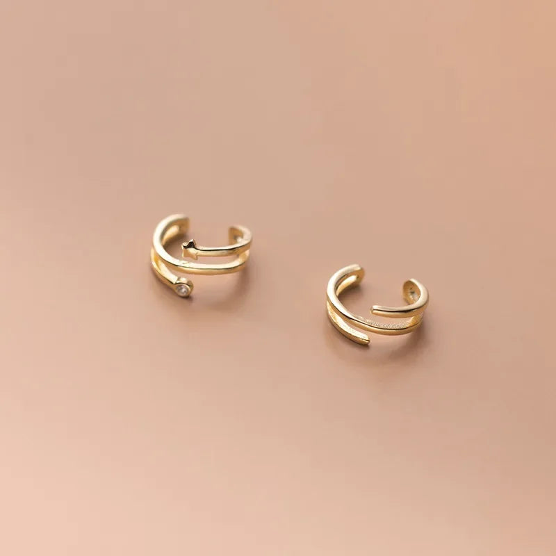 Aretes de Clip Triple Estrella con Zirconias