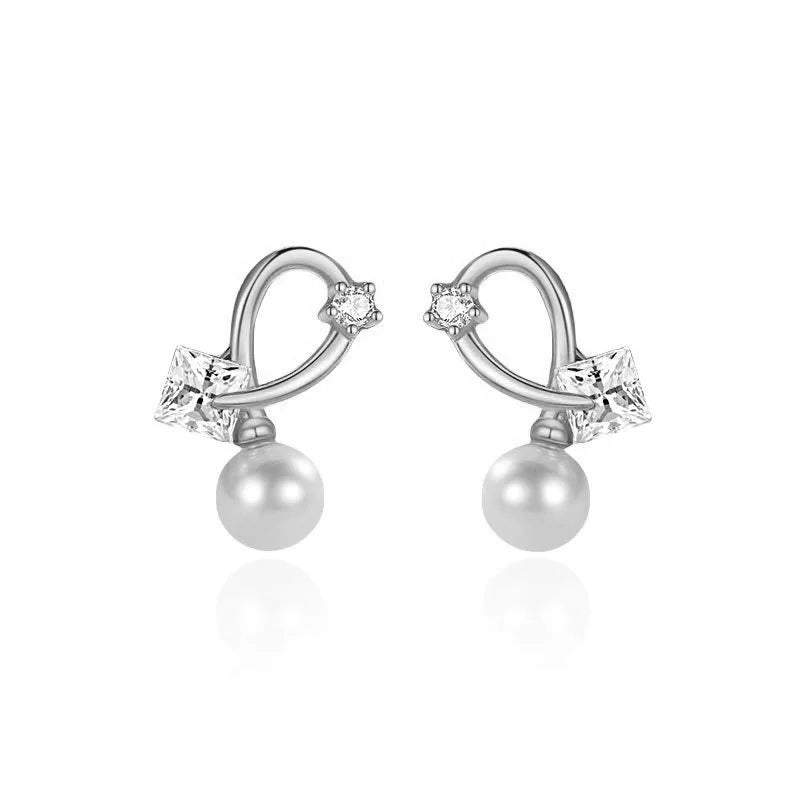 Aretes Cruz con Perla y Zirconia Cuadrada