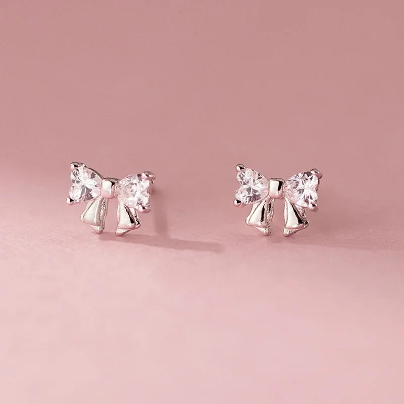 Aretes Moño con Zirconias Blancas o Rosas