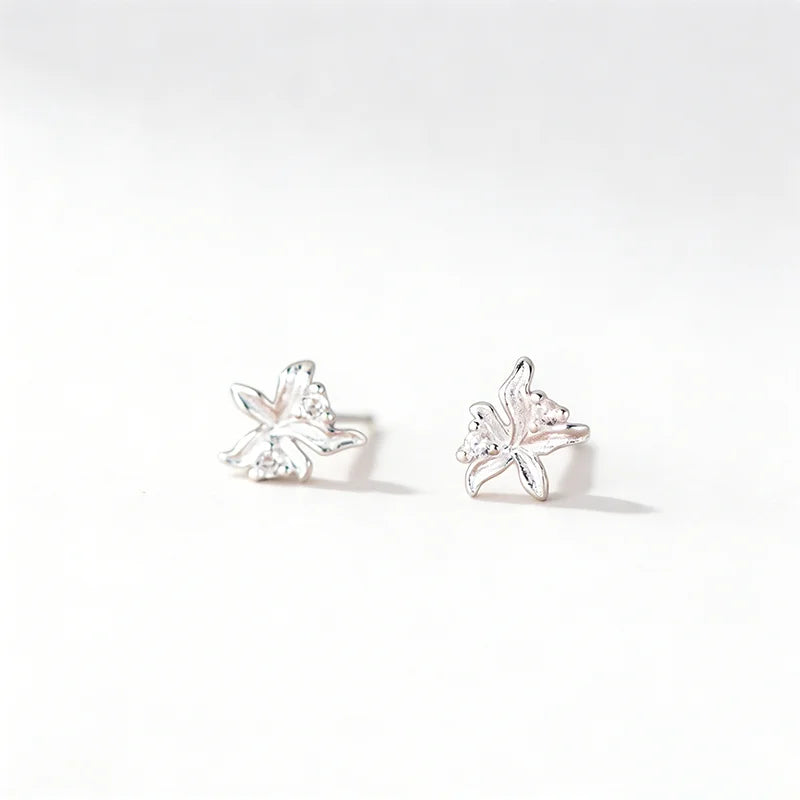 Aretes Flor de Botón Plateados