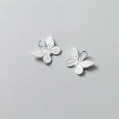 Dije Mariposa Plateada o Envejecida
