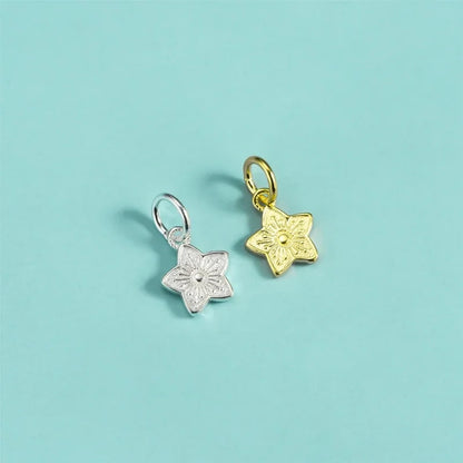 Dije Flor de Cerezo con Estrella