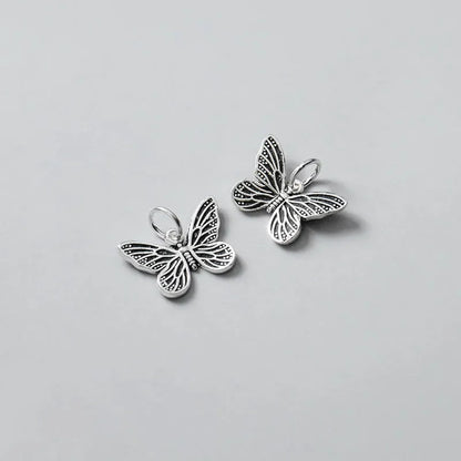 Dije Mariposa Plateada o Envejecida