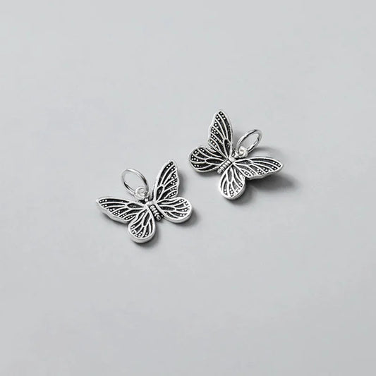 Dije Mariposa Plateada o Envejecida