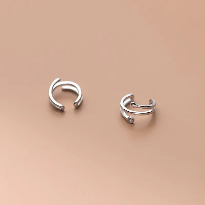 Aretes de Clip Triple Estrella con Zirconias