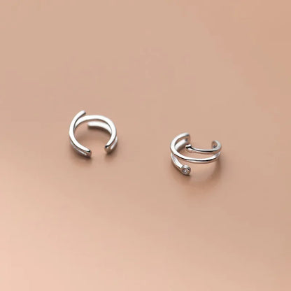 Aretes de Clip Triple Estrella con Zirconias