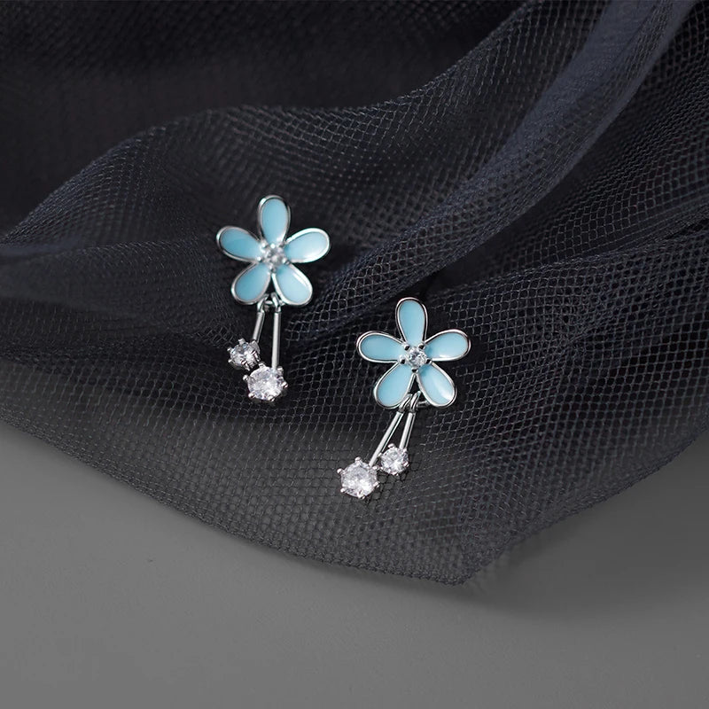 Aretes Flor Esmaltada Azul con Zirconias