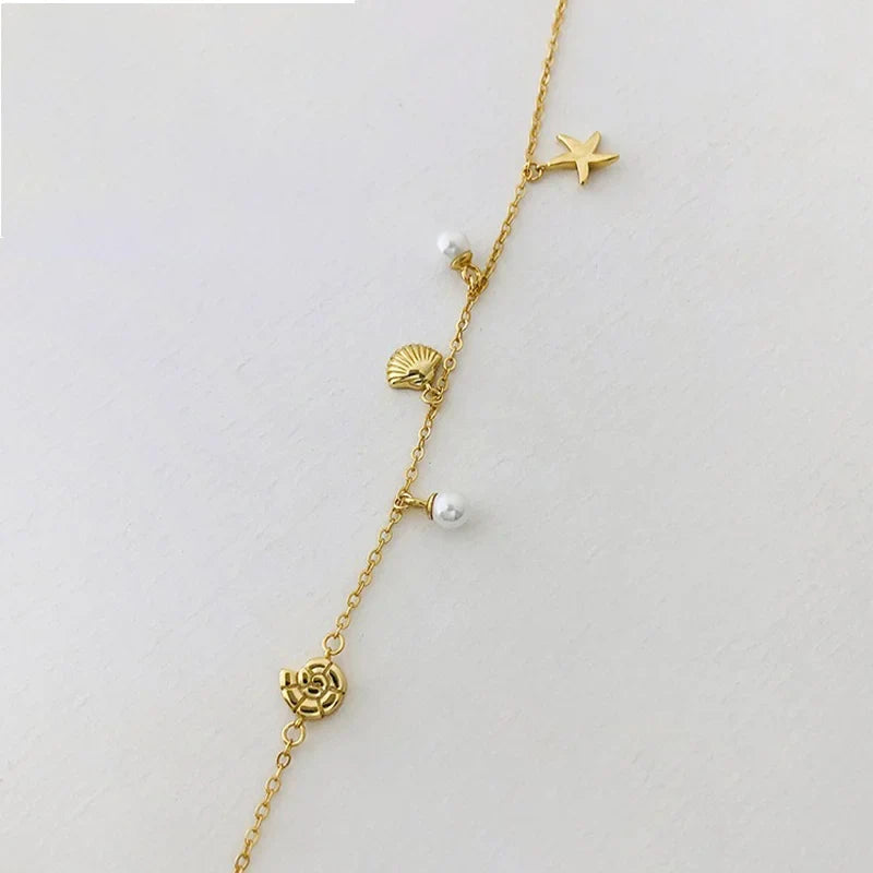 Pulsera de Esferas con Estrella y Concha