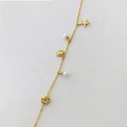 Pulsera de Esferas con Estrella y Concha