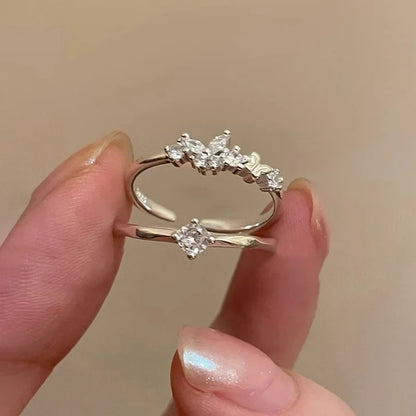 Anillo Abierto con Zirconias en Dos Modelos