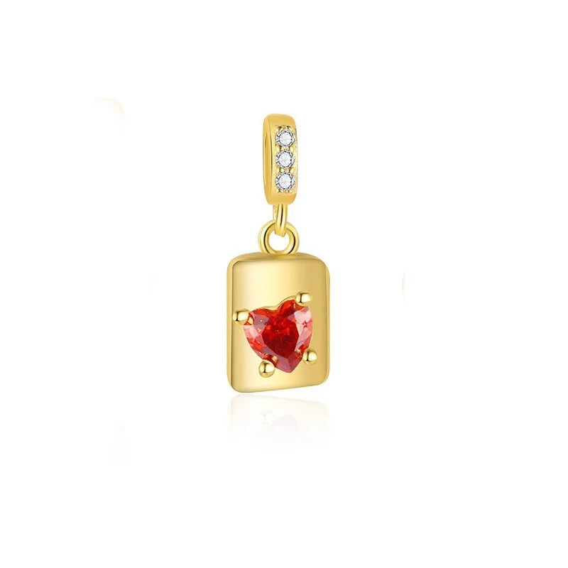 Dije Corazón Rojo y Moño con Zirconias Rosas