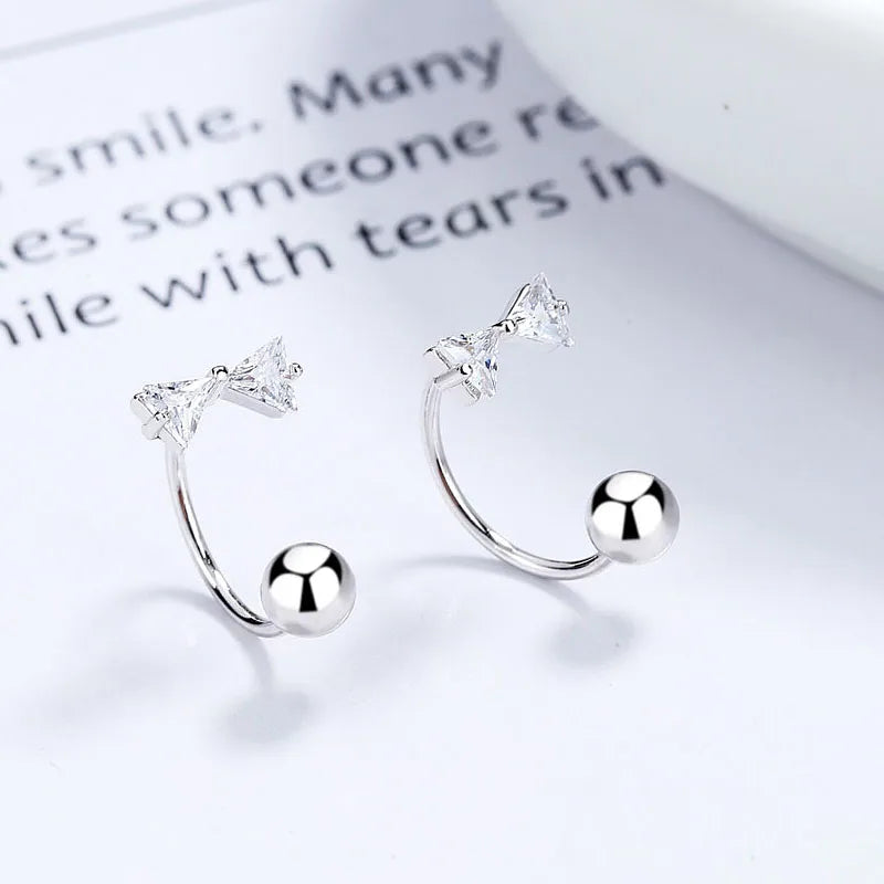 Aretes Bolita Flor o Moño con Zirconia