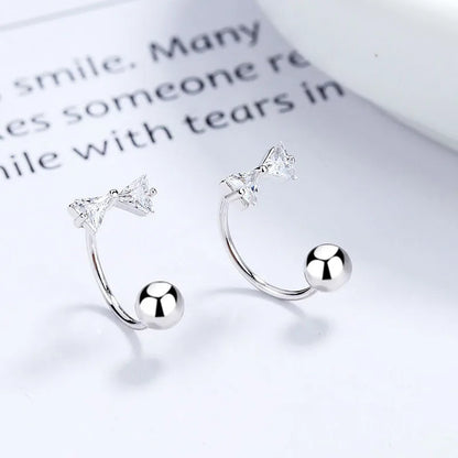 Aretes Bolita Flor o Moño con Zirconia