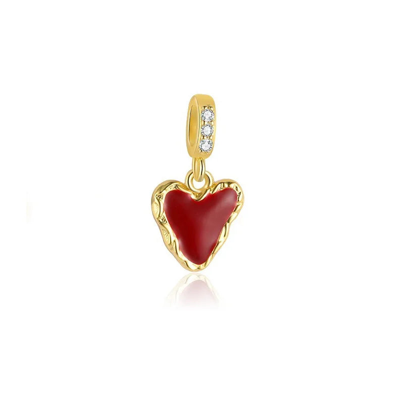 Dije Corazón Rojo y Moño con Zirconias Rosas