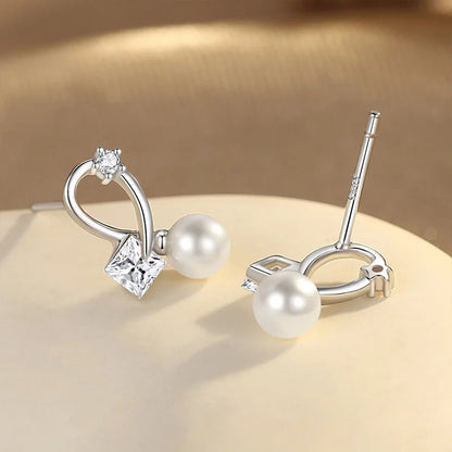 Aretes Cruz con Perla y Zirconia Cuadrada