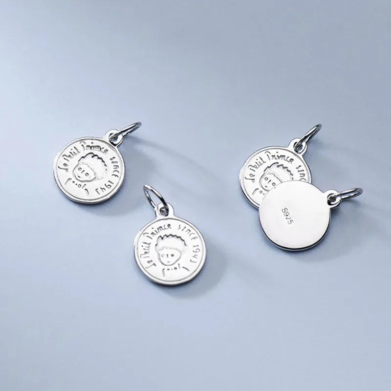 Dije Moneda con Niño