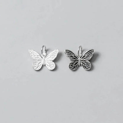 Dije Mariposa Plateada o Envejecida