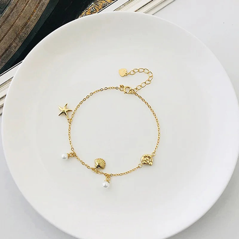Pulsera de Esferas con Estrella y Concha