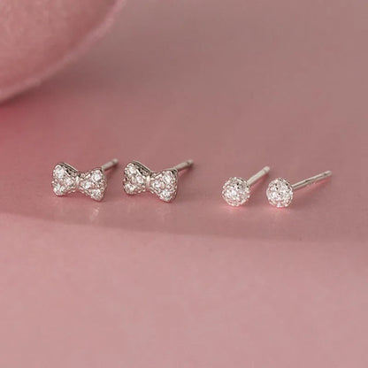 Aretes Moño o Círculo con Zirconias
