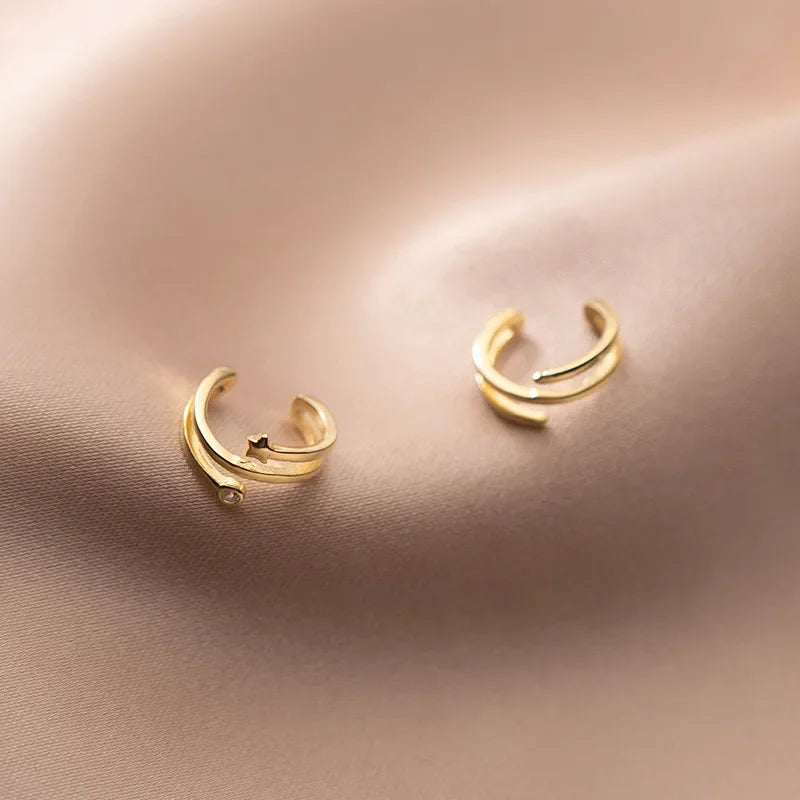 Aretes de Clip Triple Estrella con Zirconias