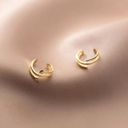 Aretes de Clip Triple Estrella con Zirconias