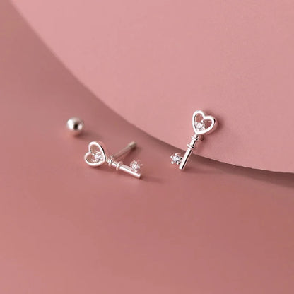 Aretes Corazón y Llave con Zirconias