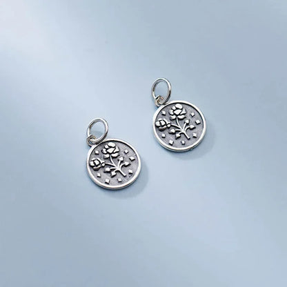 Dije Moneda Geométrica con Flor