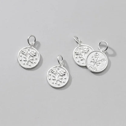 Dije Moneda Geométrica con Flor