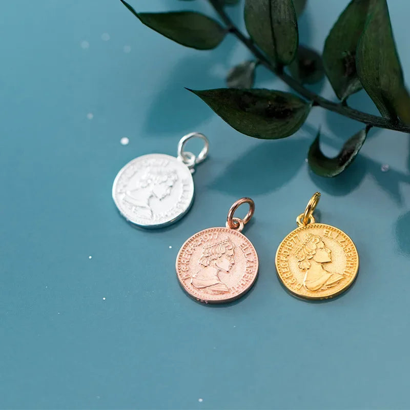 Dije Moneda de la Reina
