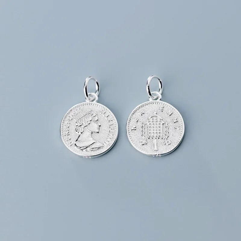 Dije Moneda de la Reina
