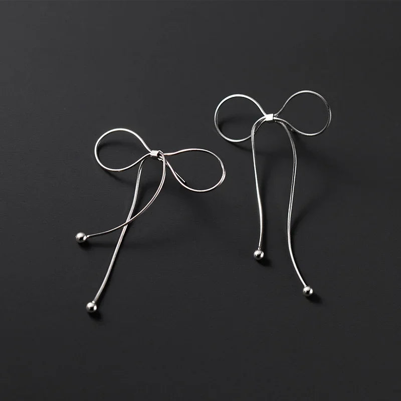 Aretes Moño con Flecos