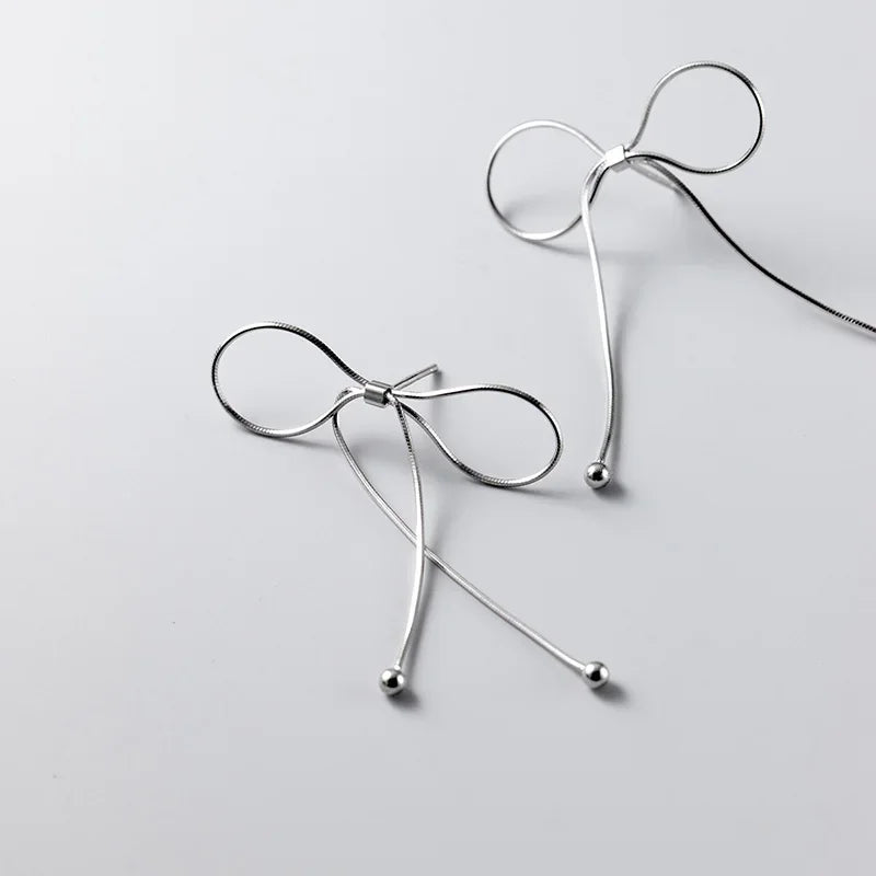 Aretes Moño con Flecos