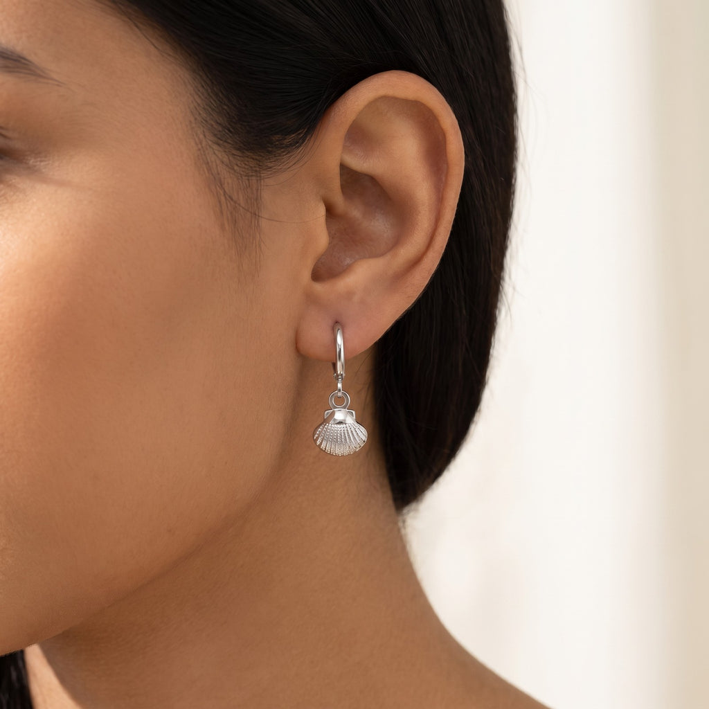 Aretes Concha plateados puestos