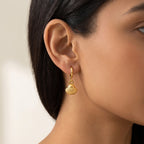 Aretes Concha dorados puestos