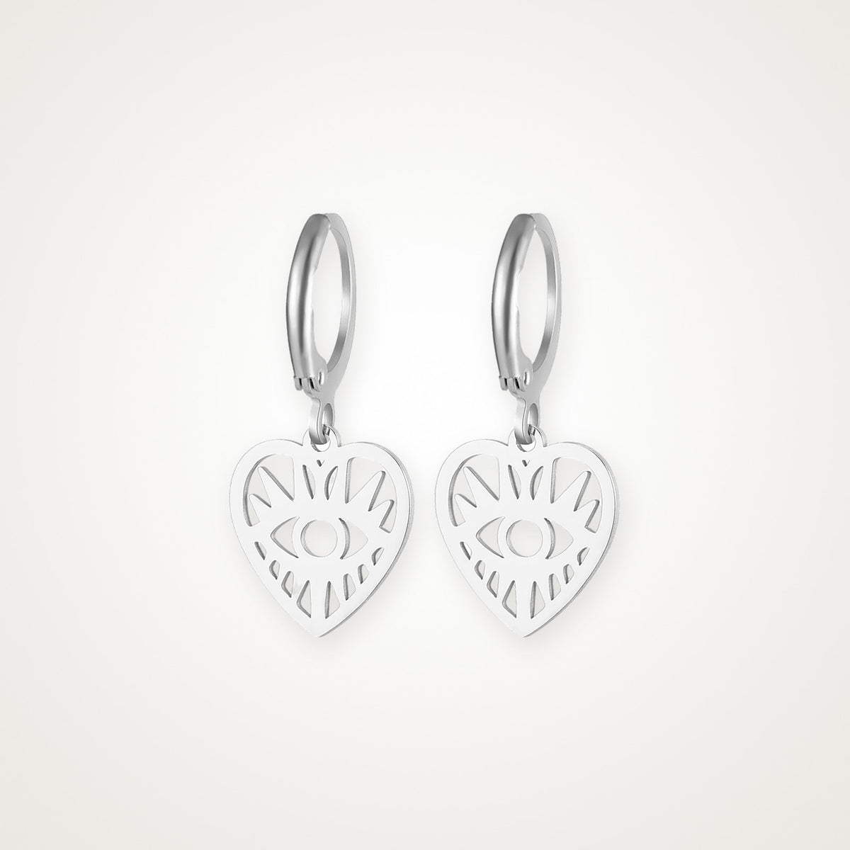 Aretes Corazón con ojo plateados