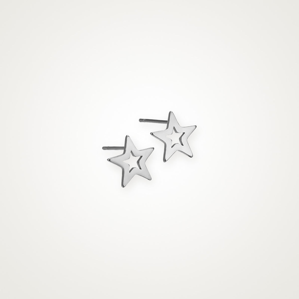 Aretes Estrella hueca plateados