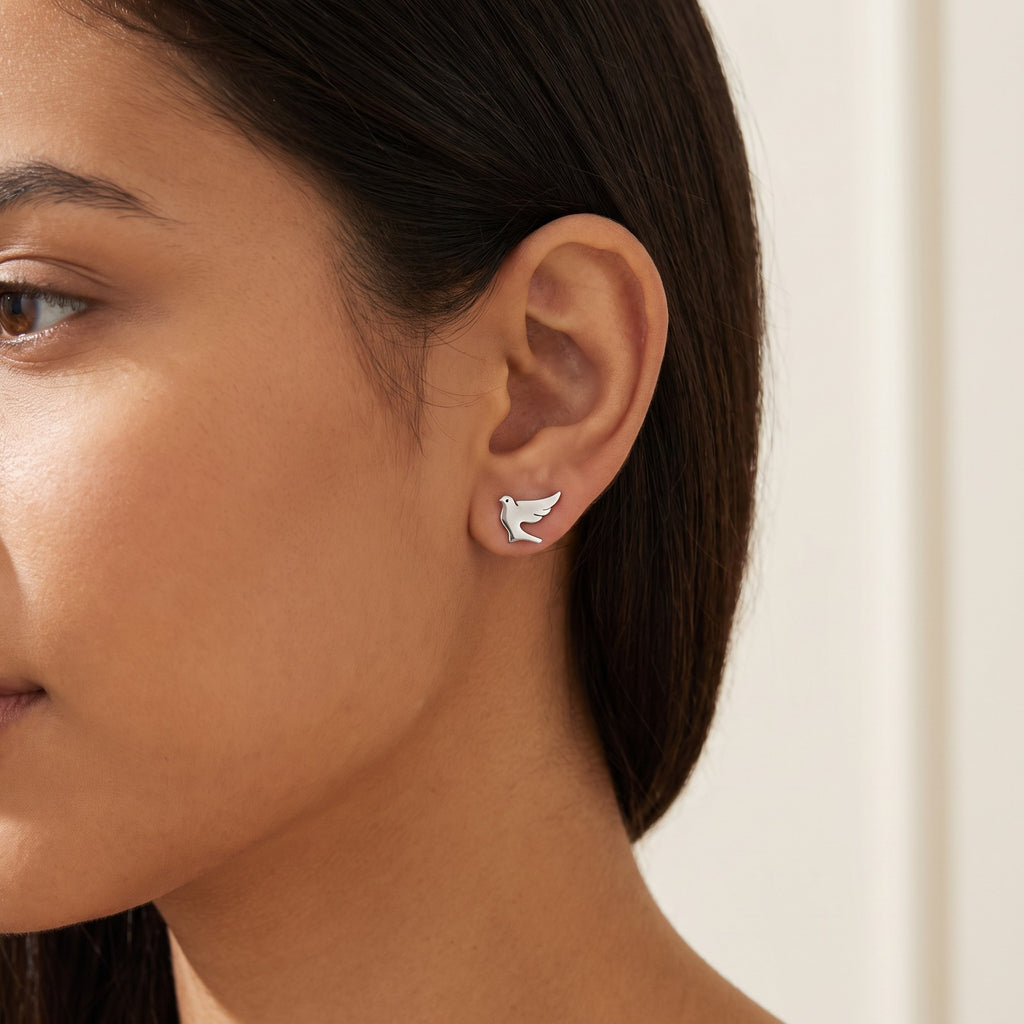 Aretes Palomitas plateados puestos