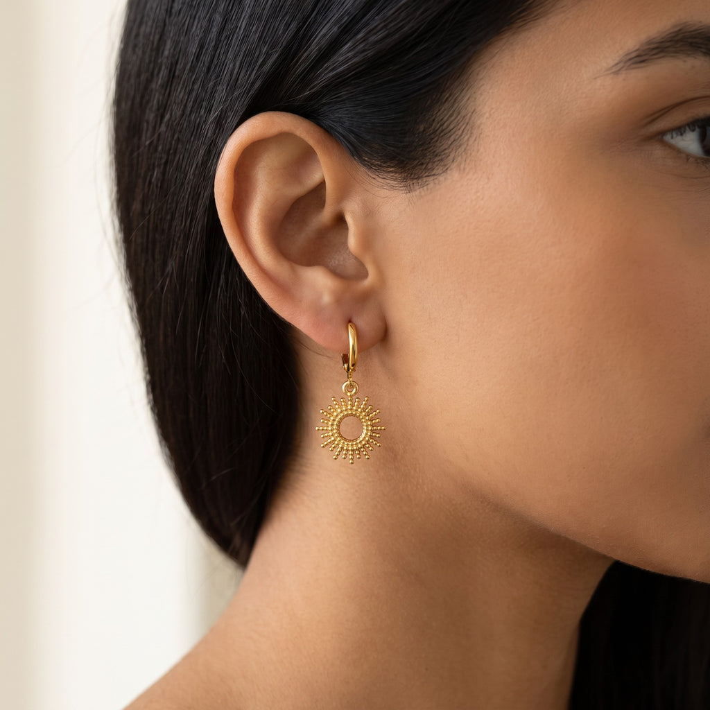 Aretes Sol dorados puestos