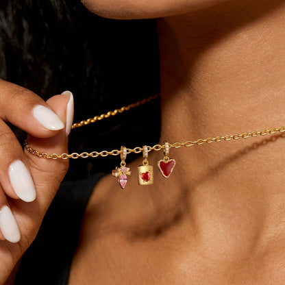 Dije Corazón Rojo y Moño con Zirconias Rosas