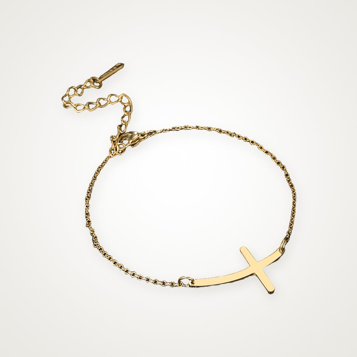 Pulsera Cruz curva dorada
