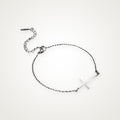 Pulsera Cruz de lado plateada